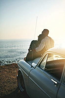 Buy stock photo Beach, couple and hug outside in car with sunset for bonding, love and support in Bali. Back, people and relationship at ocean to relax or rest on roadtrip, trip and journey for break and honeymoon