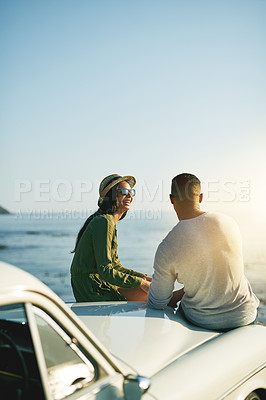 Buy stock photo Beach, couple and happy outdoor in car with sunset for bonding, love and support. Smile, people and relationship at ocean to relax or rest on road trip, adventure and journey for break and honeymoon 