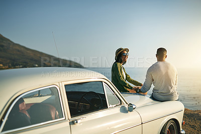 Buy stock photo Beach, couple and smile outdoor in car with sunset for bonding, love and support. Happy, people and relationship at ocean to relax or rest on road trip, travel and journey for break and honeymoon 