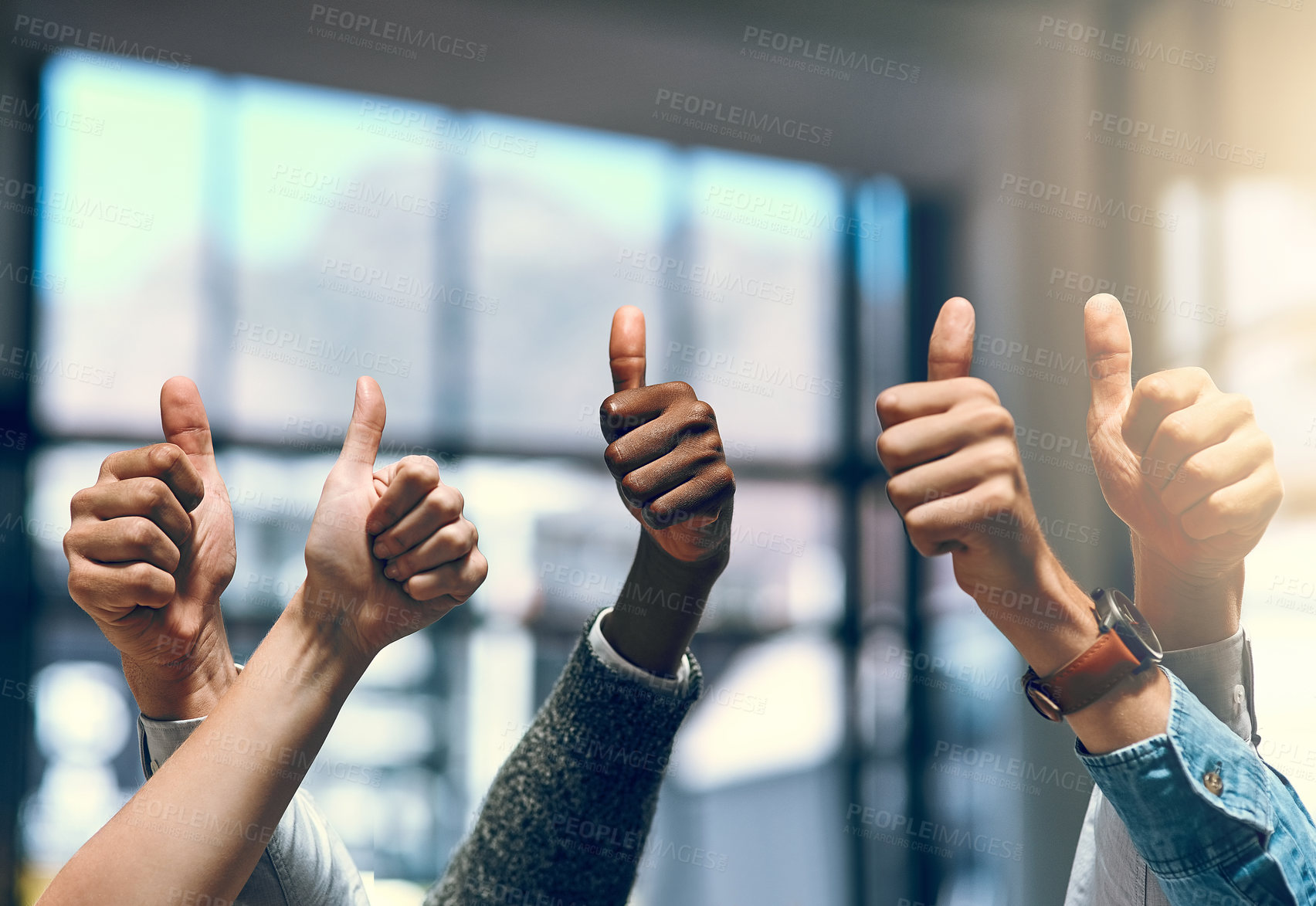 Buy stock photo Hands, thumbs up and winner with business people closeup in glass office for promotion, solidarity or unity. Agreement, like and yes with positive employee group at work for bonus, deal or success