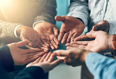 Buy stock photo Cropped shot of a group of businesspeople with their hands opened