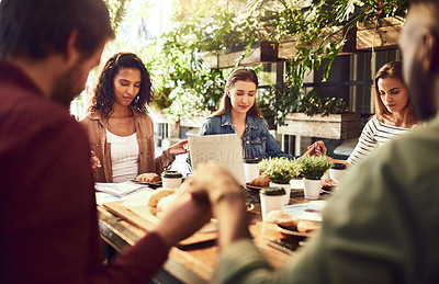 Buy stock photo Cropped shot of a group of coworkers holding their hands in prayer before they eat