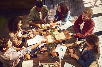 Buy stock photo High angle shot of a group of creative workers out on a business lunch