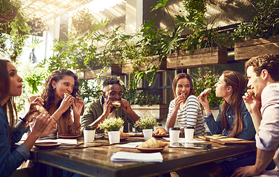 Buy stock photo Cropped shot of a group of creative workers having a meeting over lunch in a cafe