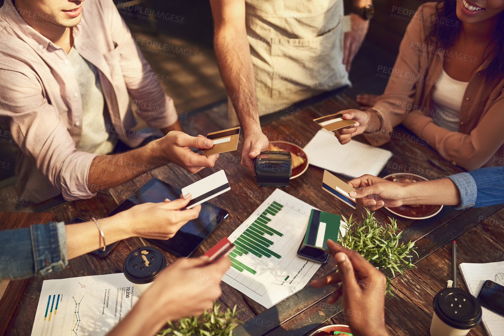 Buy stock photo Hands, credit card and friends at coffee shop for payment or banking on pos machine. Waiter, people and debit with money at cafe for finance with business group in meeting to split bill in top view