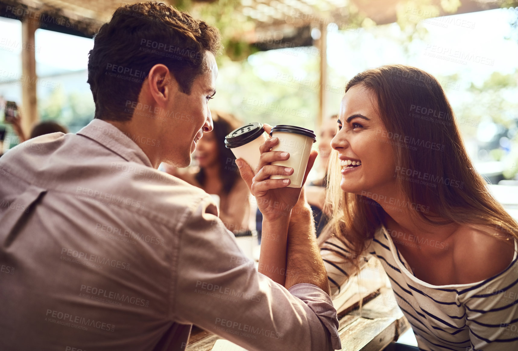 Buy stock photo Happy, couple and linking arms with coffee at cafe for bonding, conversation and celebration together. Man, woman and warm drink with gesture at restaurant for gathering, romance and connection