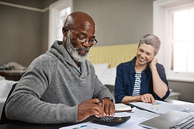 Buy stock photo Calculator, documents or finance with an old couple busy on a budget review in the home together. Accounting, taxes or investment with a senior man and interracial woman planning insurance or savings