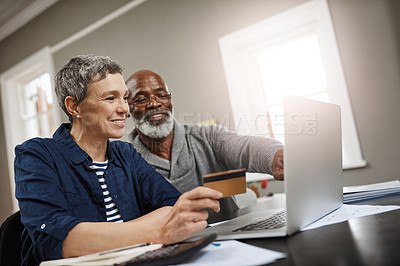 Buy stock photo Credit card, laptop and senior couple for online shopping, ecommerce and fintech payment for home insurance. Finance, pension or financial investment of biracial woman and partner on computer banking