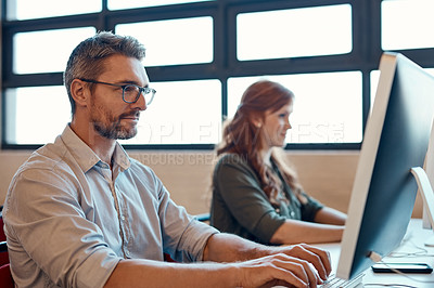 Buy stock photo Happy, mature man and coworking office with desk, working together and communication on computer. Thinking, project collaboration and startup with people at web design studio for creative teamwork