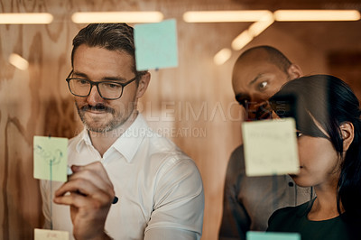 Buy stock photo Businessman, writing and brainstorming in meeting for planning, schedule or team strategy at the office. Man employee in leadership or presentation for training staff on sticky note or project plan