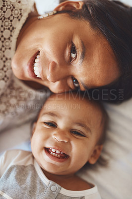 Buy stock photo Cropped shot of a mother and her adorable son lying together