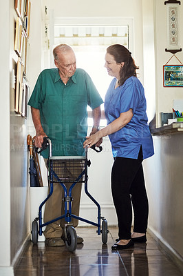 Buy stock photo Senior man, walker and help with nurse for physiotherapy, healthcare or trust at old age home. Woman, medical caregiver or volunteer talking to person with a disability in retirement for support