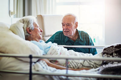 Buy stock photo Cropped shot of a senior man visiting his sick wife in hospital