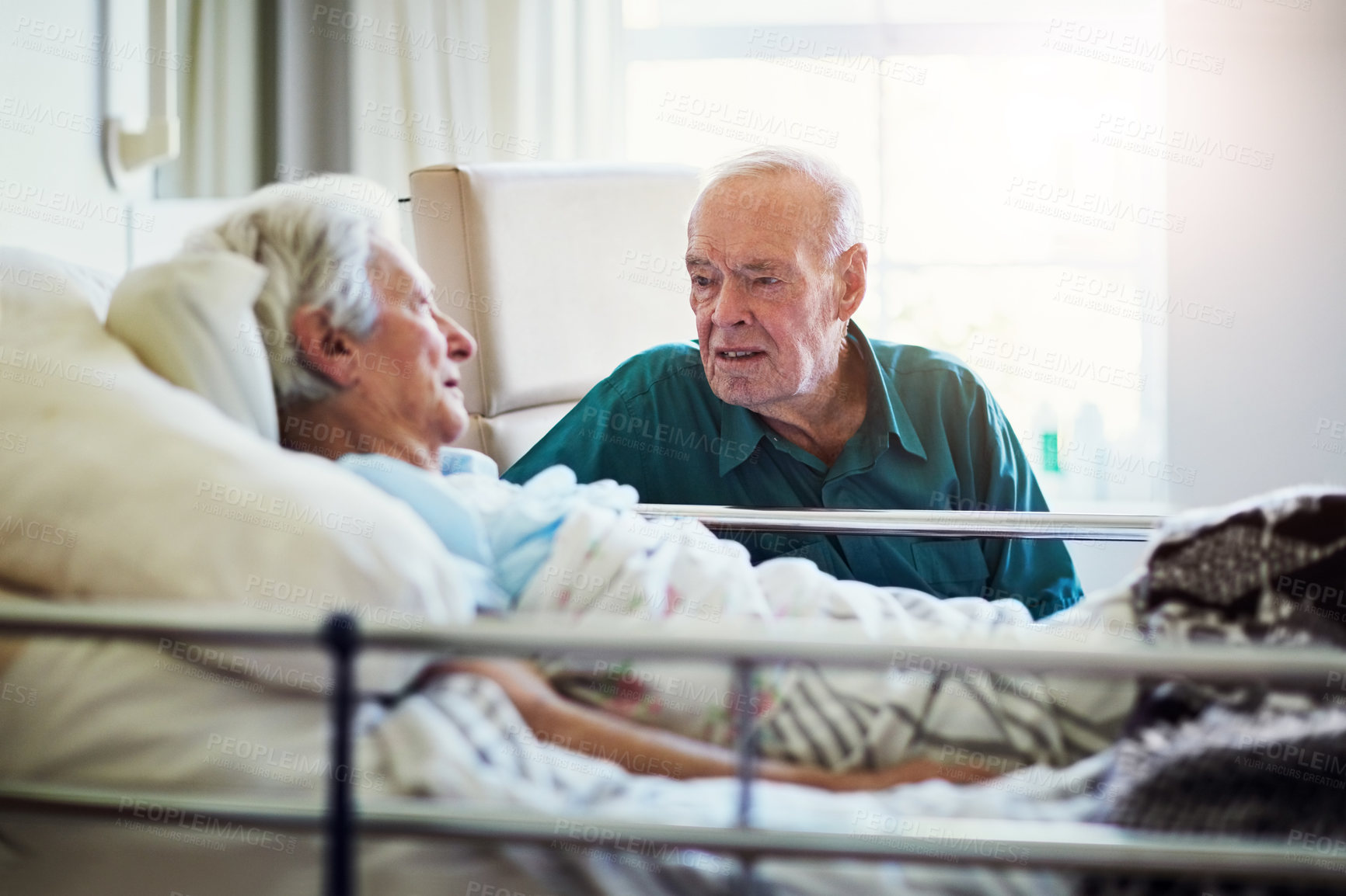 Buy stock photo Love, elderly man and support in hospital for wife, healthcare and empathy for sickness. Discussion, cancer and male person in clinic with woman for conversation, connection and together for hope