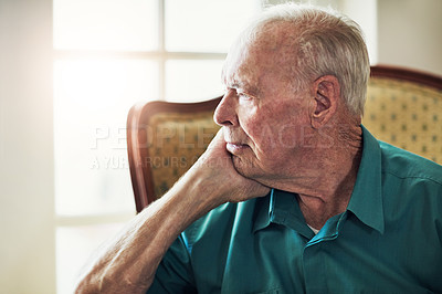 Buy stock photo Elderly, man and depression with thinking of memory in retirement home with remember, nostalgia or reflection on sofa. Senior, person and sad with alzheimers, lonely and thoughtful on couch in lounge