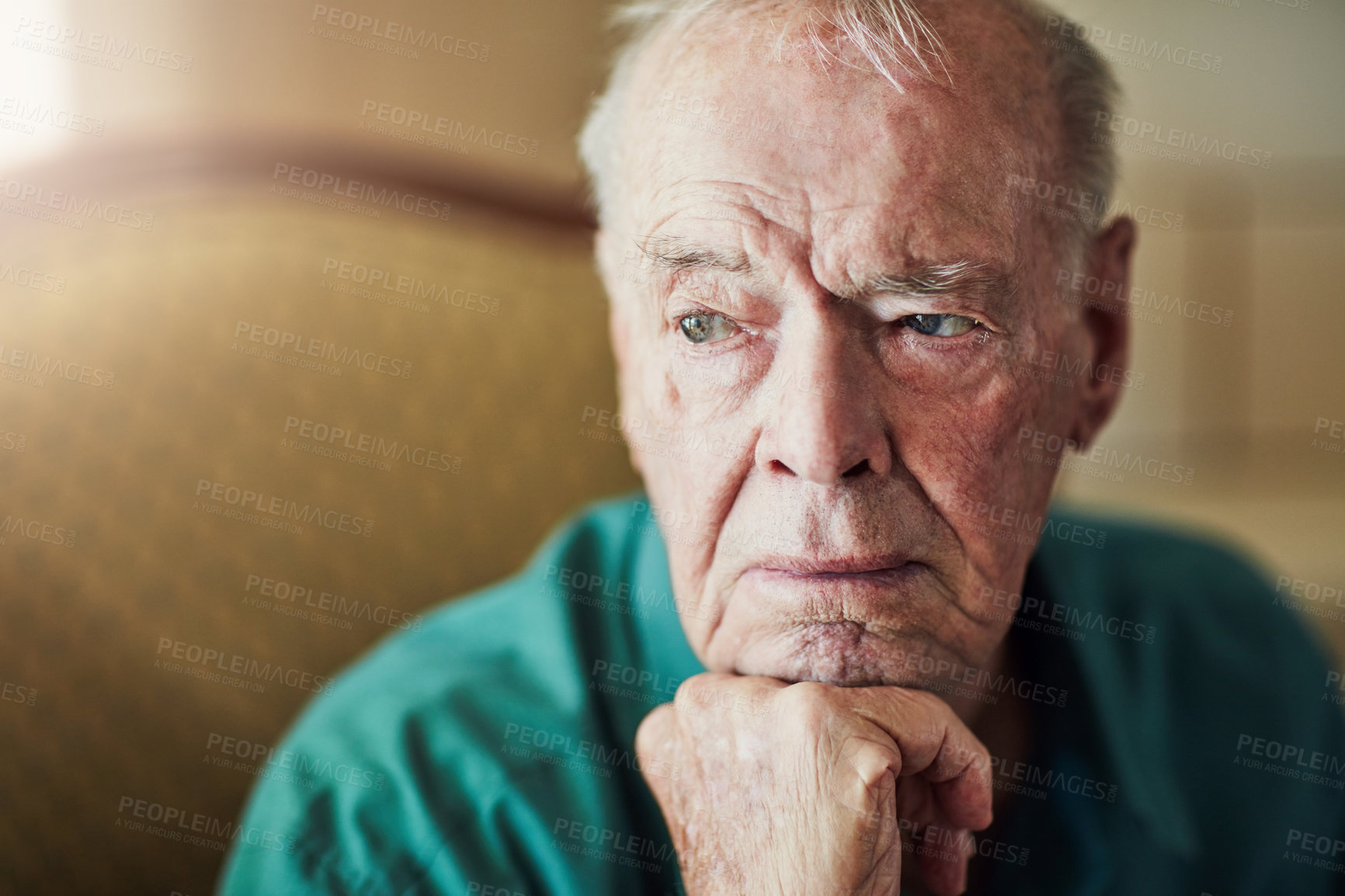 Buy stock photo Elderly, man and sad with thinking of memory in retirement home with remember, nostalgia or reflection on sofa. Senior, person and lonely with alzheimers, depression and thoughtful on couch in lounge