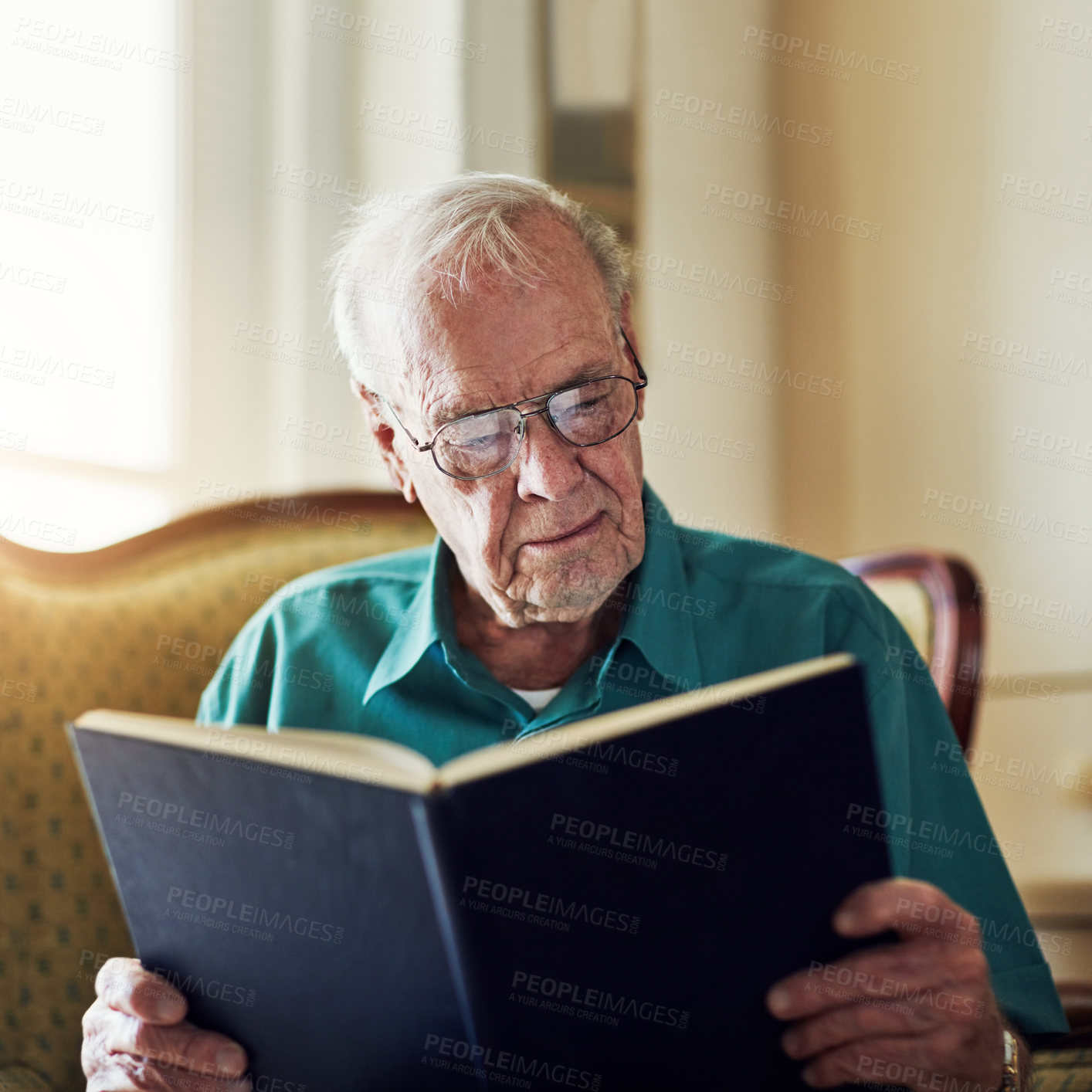 Buy stock photo Elderly man, study and reading book in home, literature and language for learning in retirement. Old person, fiction and textbook for knowledge to relax, glasses and fantasy story or information