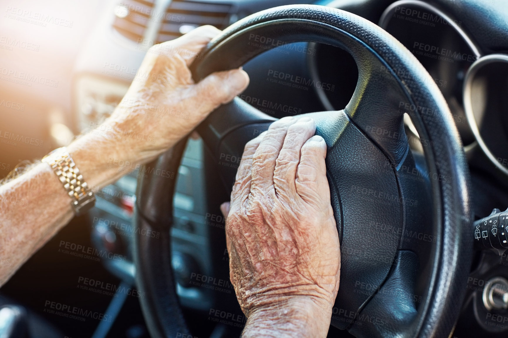 Buy stock photo Closeup of an unrecognizable senior man's hands on the steering wheel of his car