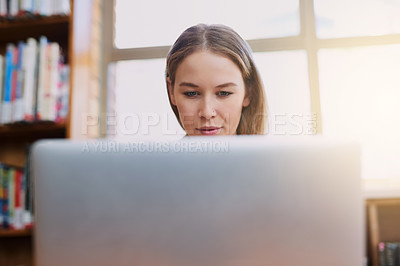 Buy stock photo University, library and woman with laptop checking website, article or schedule for online course. Computer, research and college student on digital app for study project, elearning or reading report