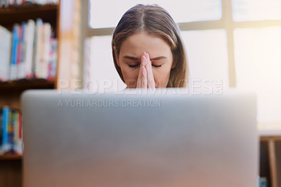 Buy stock photo Stress, library and woman with laptop, headache and fatigue and overtime on research project at university. Hope, prayer and tired college student with deadline, study schedule and online education