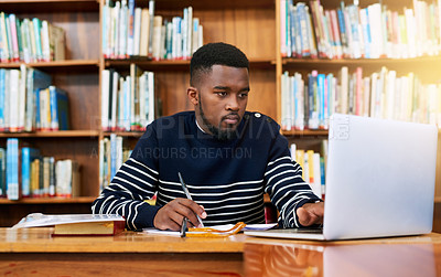 Buy stock photo Laptop, library and university student with research, learning and planning for exam, report or focus on studying, goals and education. Black man, college and working on task, essay or scholarship