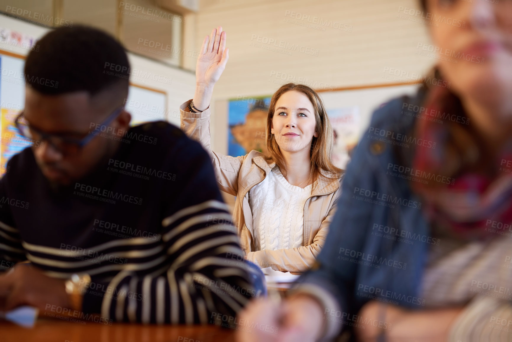 Buy stock photo Woman, student and hand raised for education, classroom or happy with solution for test at university. Person, thinking and excited for learning, question or answer for quiz with diversity at college