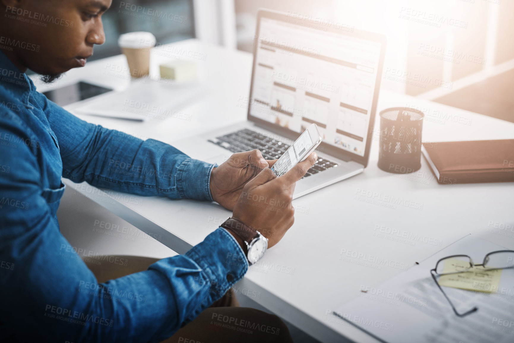 Buy stock photo Closeup, business and African man with a smartphone, typing and connection for social media. Male professional, consultant and employee with a cellphone, mobile app and communication in the workplace