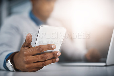 Buy stock photo Tech, phone and hand of man at desk for communication, networking or online research at startup office. Laptop, smartphone and businessman with internet, connection and career in web management