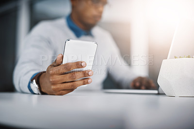 Buy stock photo Laptop, smartphone and hand of man at desk for communication, networking or online research at tech startup. Computer, phone and businessman with internet, connection and career in web management