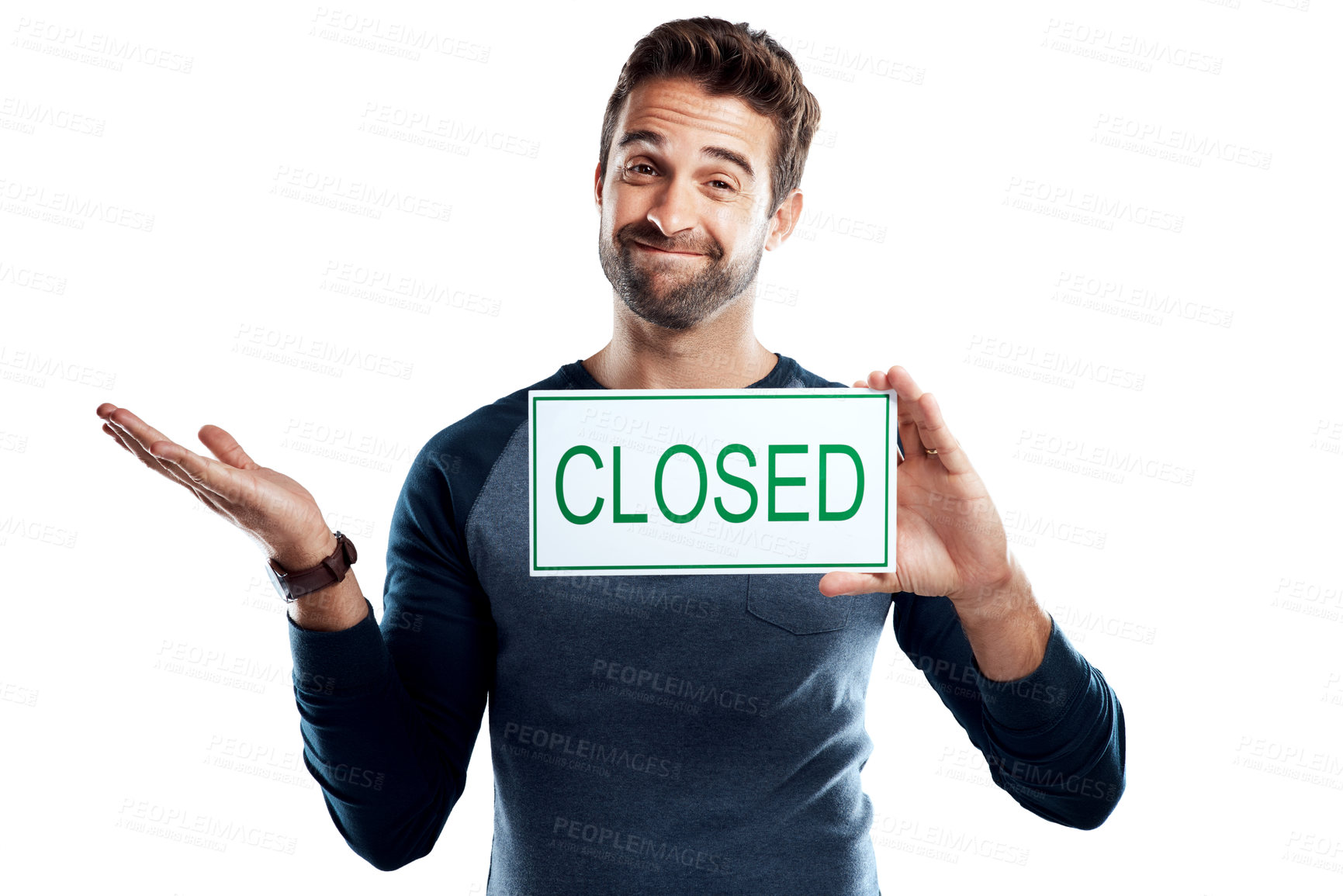 Buy stock photo Studio portrait of a handsome young man holding a closed sign against a white background