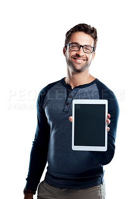 Buy stock photo Studio portrait of a handsome young man holding a digital tablet with a blank screen against a white background
