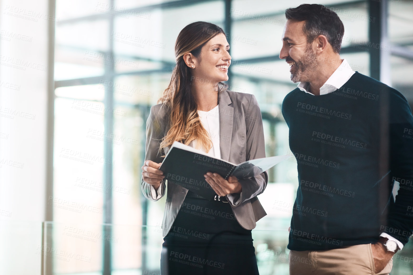 Buy stock photo Man, woman and paperwork for discussion in office for teamwork, reading or review for proposal. Business people, partner and attorney for feedback, compliance or conversation for results in workplace