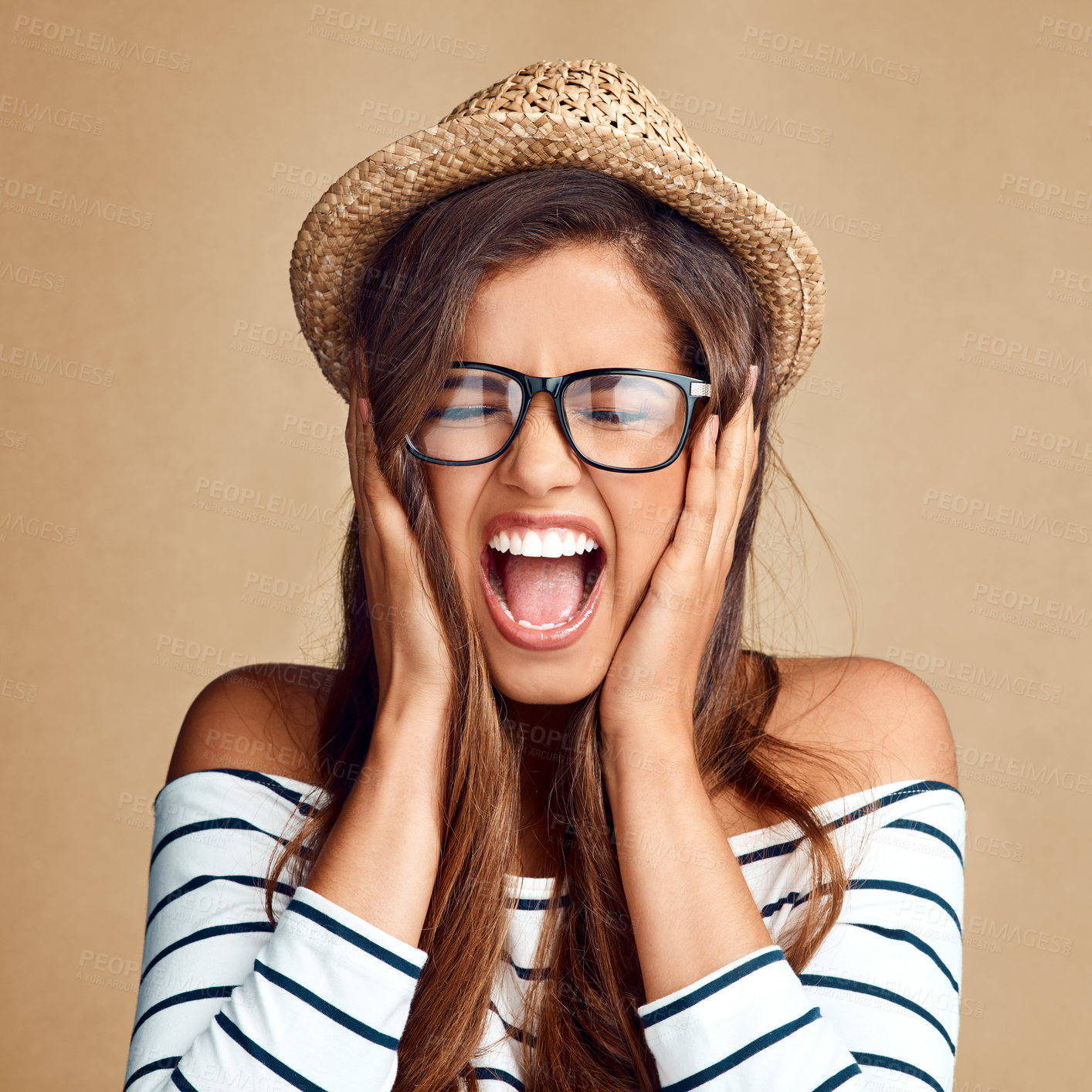 Buy stock photo Frustrated girl, screaming and fashion with hat in studio for loud noise on a background. Angry, female person or young model yelling and shouting with irritatted expression or crazy emotion