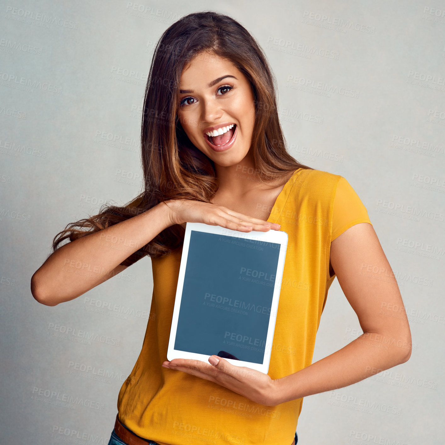 Buy stock photo Excited woman, portrait and tablet with screen for app, advertising or marketing on a studio background. Happy female person or model with smile for technology display, presentation or mockup space