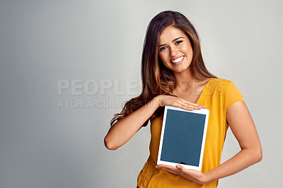 Buy stock photo Happy woman, portrait and tablet screen with mockup space for advertising or marketing on a studio background. Young female person, model or smile for technology display, presentation or showcase app