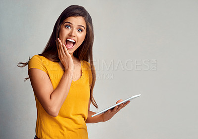 Buy stock photo Woman, portrait and surprised with tablet in studio background on internet for online sale and announcement. Female person, happy and mockup space with wow or notification and offer for discount