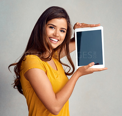 Buy stock photo Happy woman, portrait and display with tablet screen for advertising, marketing or app on a studio background. Young female person or model with smile for technology or presentation on mockup space