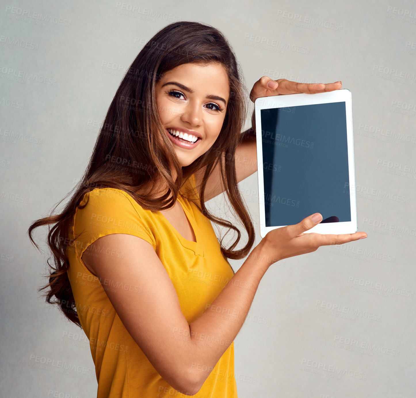 Buy stock photo Happy woman, portrait and display with tablet screen for advertising, marketing or app on a studio background. Young female person or model with smile for technology or presentation on mockup space