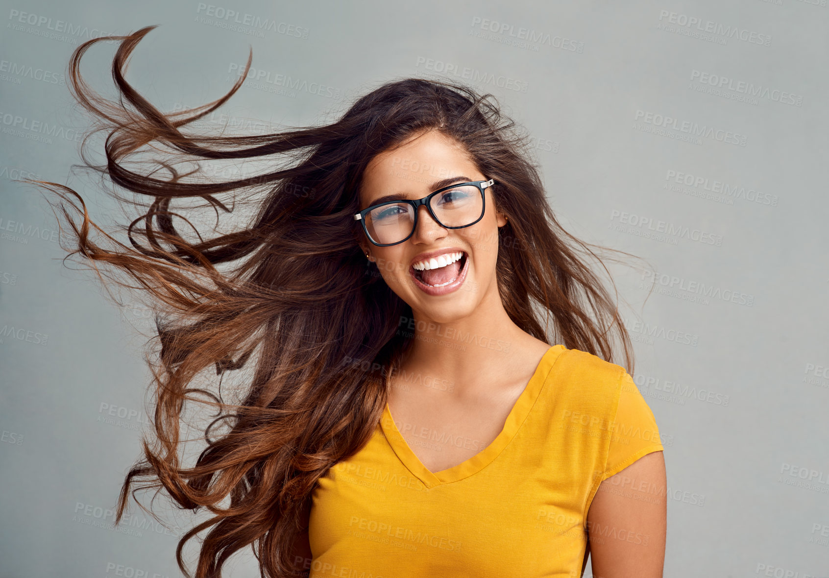 Buy stock photo Studio, crazy and portrait of woman with glasses, confidence  and positive attitude in trendy fashion. Happy, face and girl in gen z style with pride, vision and eye care wellness on grey background