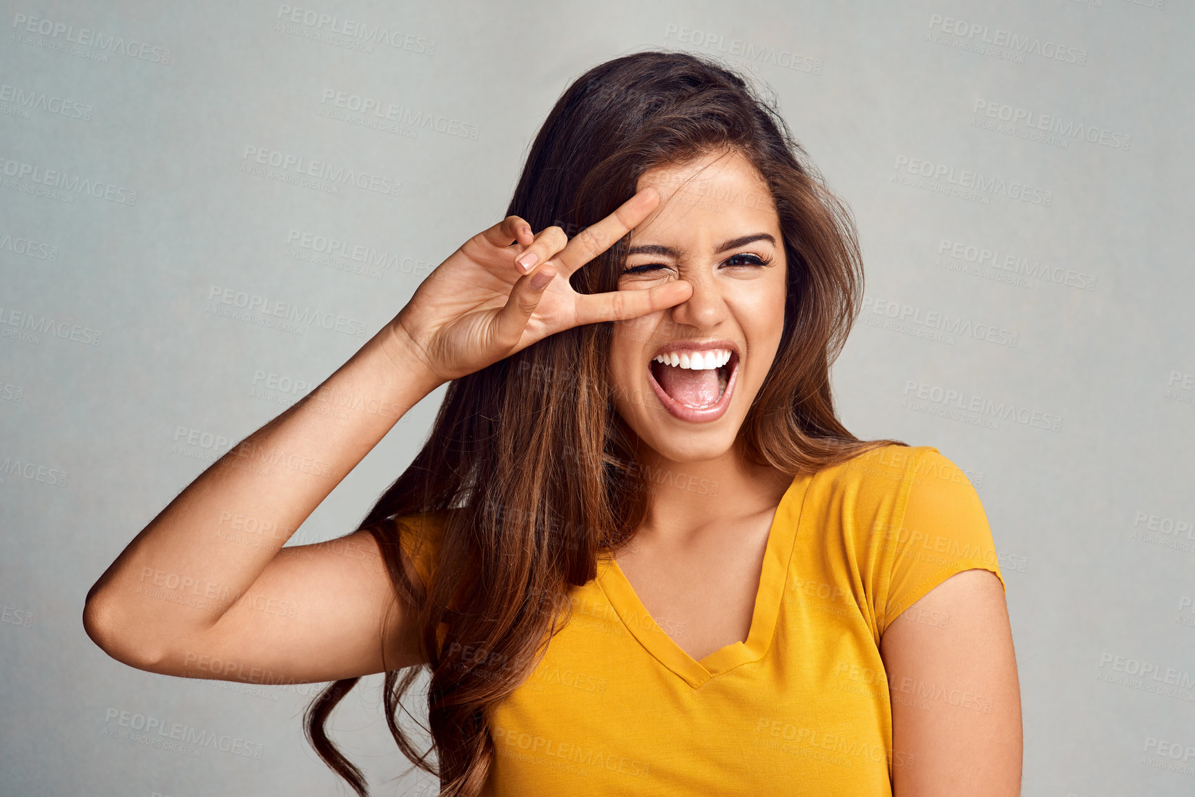 Buy stock photo Portrait, hand and excited woman with peace sign in studio with smile for happiness, good mood or face expression on white background. V, emoji and model for gesture, positive attitude or symbol