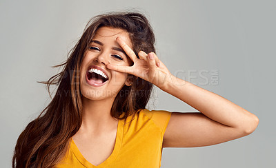 Buy stock photo Peace sign, smile and female model with portrait in studio with happiness for freedom, good mood or face expression on white background. V, emoji and woman for hand gesture, positivity or confidence