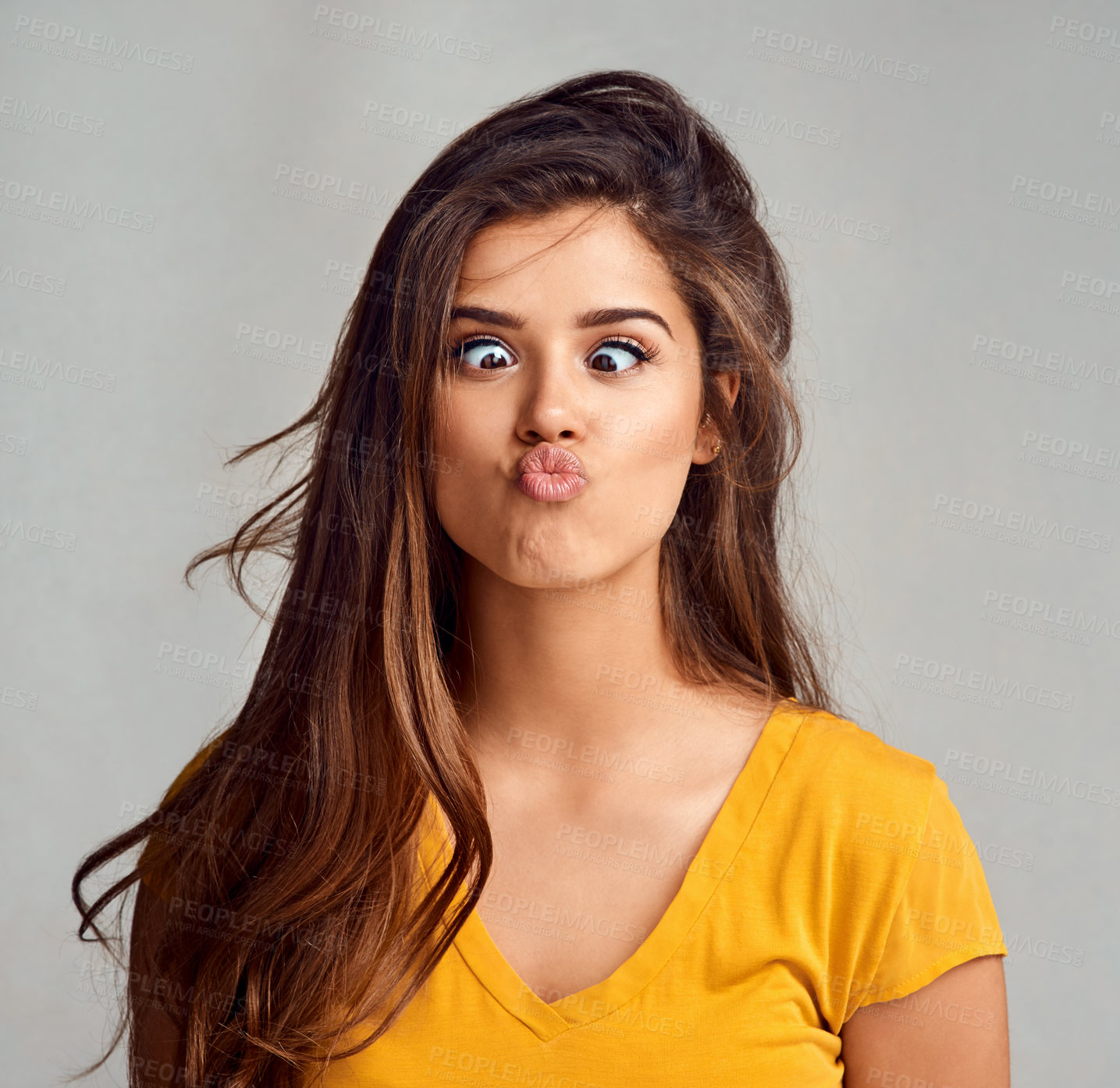 Buy stock photo Pout, goofy and face of woman in studio with crossed eyes for emotion, facial expression and crazy reaction. Comic, humor and isolated person with emoji, silly and funny pose on gray background