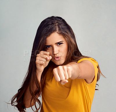 Buy stock photo Hands, fight and portrait of woman in studio for female empowerment, human rights and activism. Strength, justice and person with fist for gesture of change, protest and equality on white background