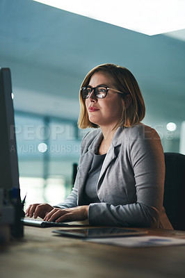 Buy stock photo Desktop, typing and business woman in office, working late on project and focus at night. Computer, professional and female person writing email, report or planning, reading and overtime for deadline