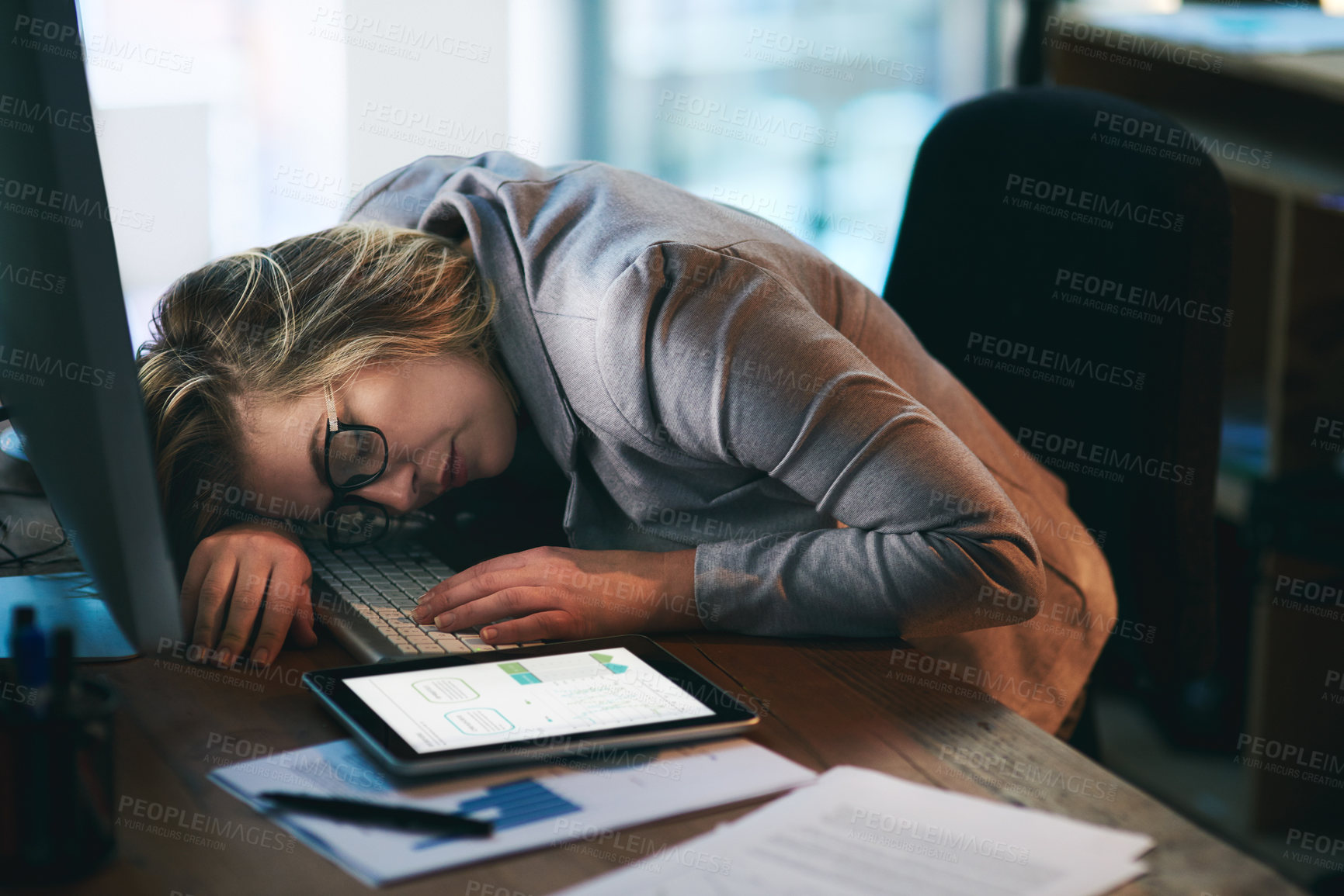 Buy stock photo Tired woman, desk or sleeping at night with burnout in stress, anxiety or depression at office. Female person or business employee asleep after working late for rest, break or overworked at workplace