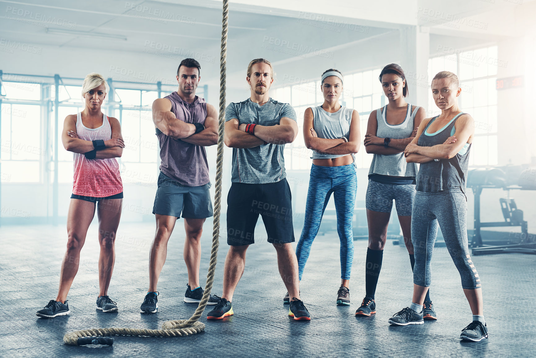 Buy stock photo Rope, portrait and group of people in gym for health, wellness and body workout challenge. Fitness class, friends and team of athletes with personal trainer for exercise together in sports center.