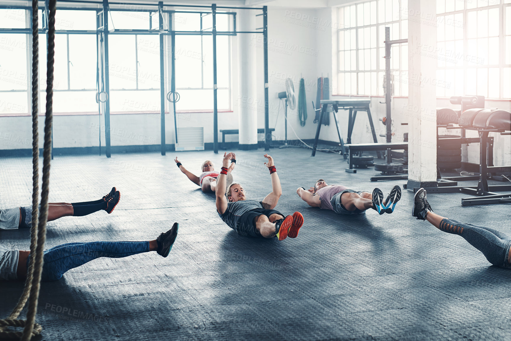 Buy stock photo Gym, fitness and group workout on floor for core exercise, wellness or health. Club, abs and people training together with hollow body hold for strong muscle, power or energy with team in sport class