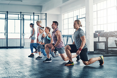 Buy stock photo Shot of an accountability group working out at the gym