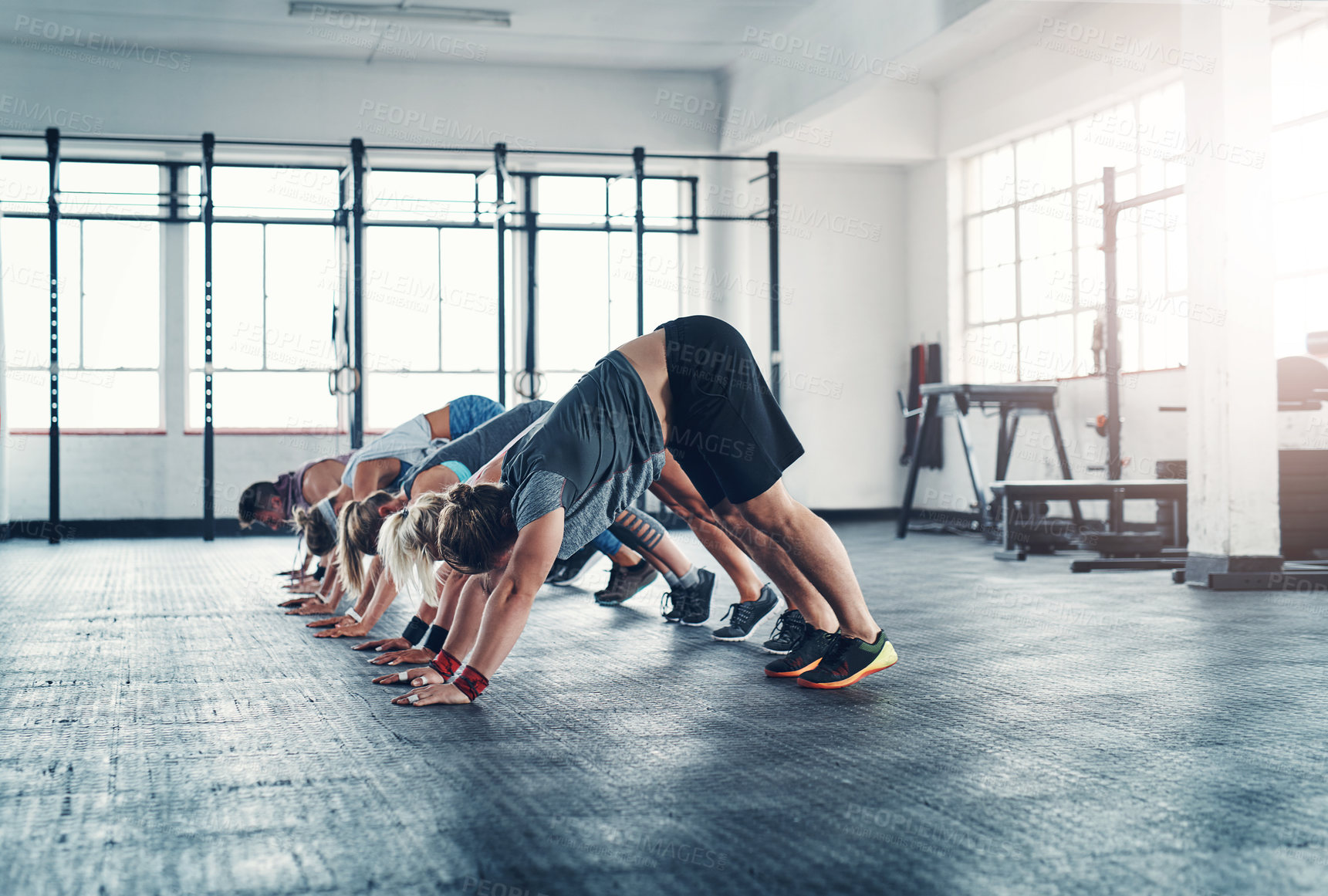 Buy stock photo Warm up, people and group stretching in gym for health, wellness and body workout. Team, sports and personal trainer challenge with active routine for cardio exercise at class in fitness center