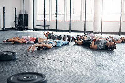 Buy stock photo Athlete, fitness and circle on floor for exercise, workout and training at gym. People, men and women group together for sports challenge, routine and warm up at wellness club for weight sit up